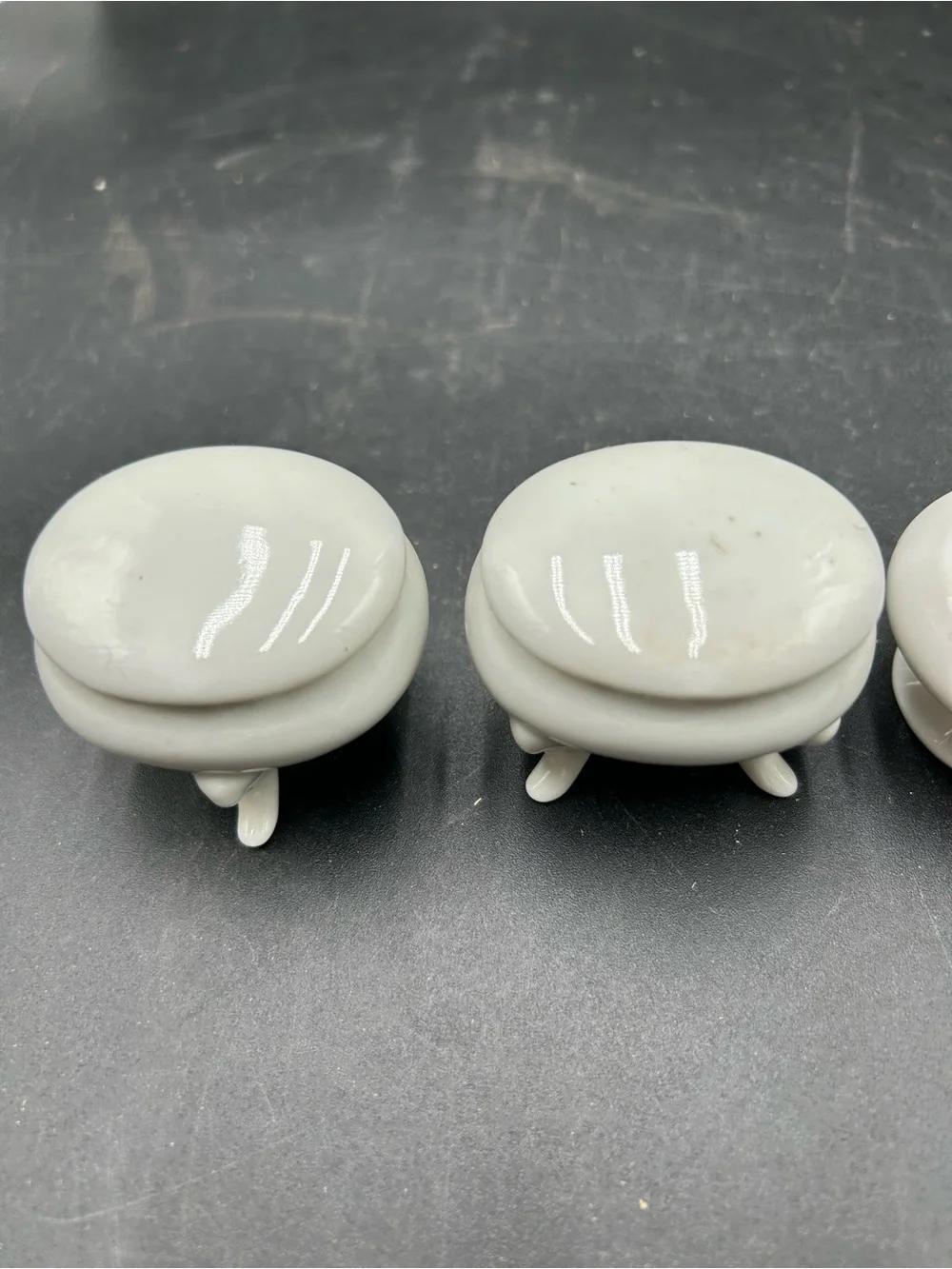 Set of 3 Small White Porcelain Footed Trinket Boxes and A Small White Basket